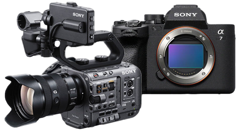 Kit And Software Nathan Mountain Videography | Two Sony cameras: on the left, a professional video camera with multiple buttons, dials, and a large lens; on the right, a Sony Alpha 7 series mirrorless camera body with its lens removed, revealing the image sensor. Both cameras are shown on a white background. | Nathan Mountain | Freelance Camera Operator and Editor
